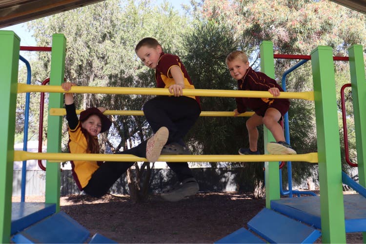 Students playing outside on equipment