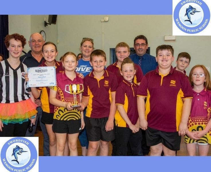 Students holding a trophy