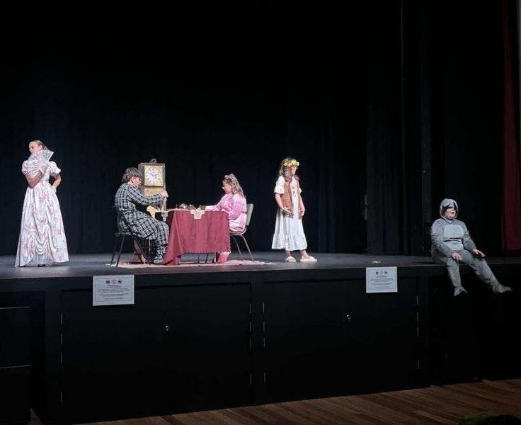 Students on stage performing the play Fearless